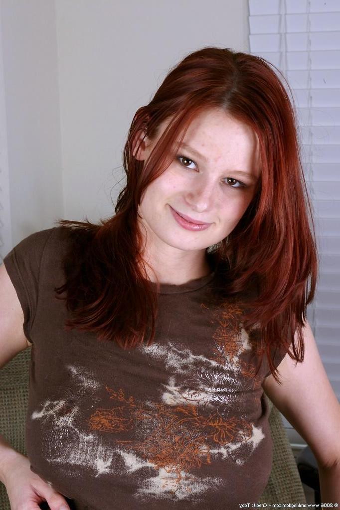 15P Redhead shows big tits and pulls on her shaved cunt lips