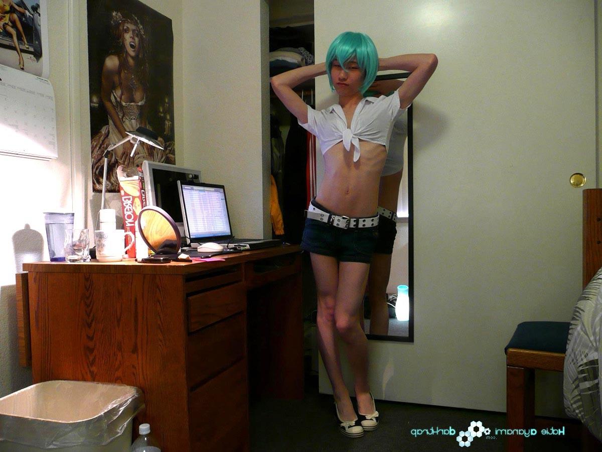 16P Young japanese newhalf in blue wig posing