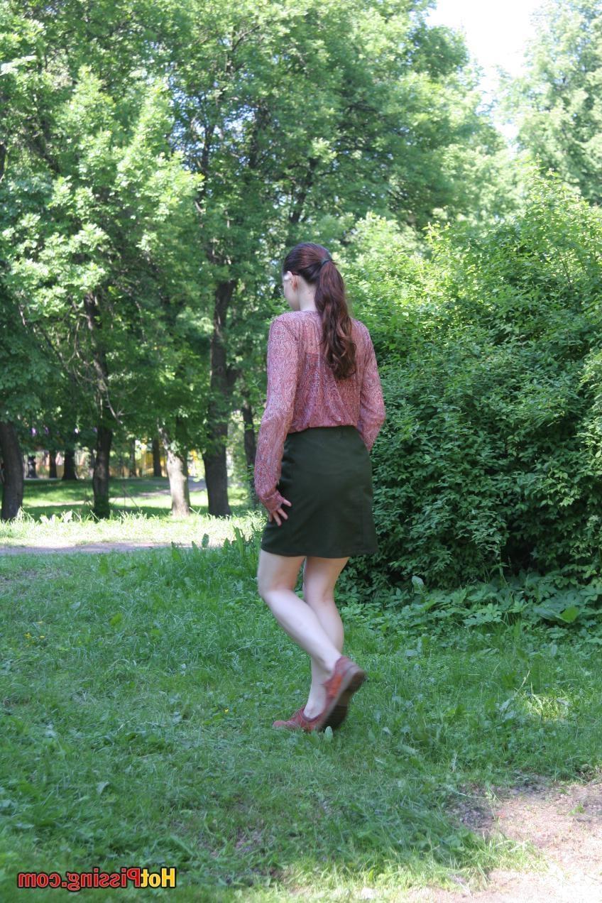 15P Cutie in glasses breaks her park walk and does a wee-wee cautiously