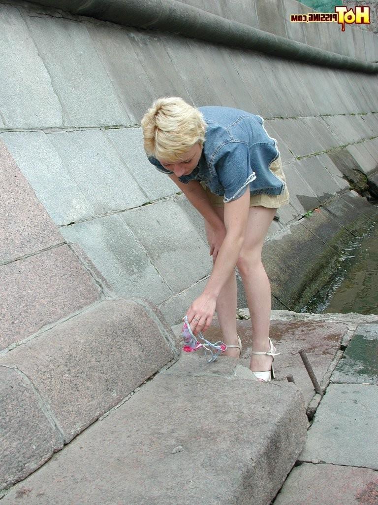 15P Adventurous blondie enjoys urinating and pussy spreading riverside