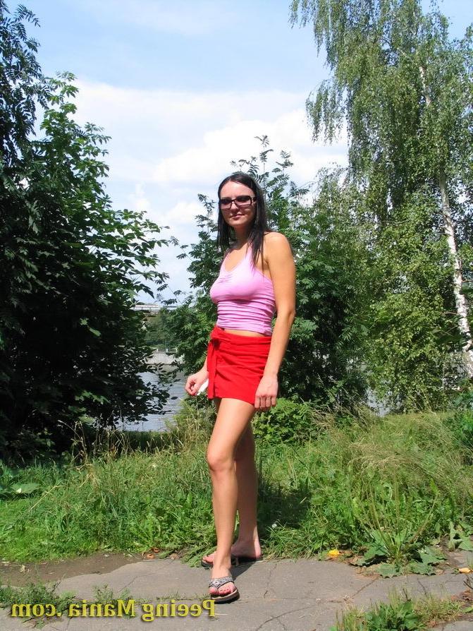 15P Hot brunette enjoys making a big puddle of spicy pee on the river bank