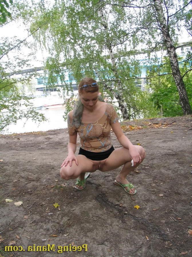 15P Longhaired beauty lifts up her skirt and squats to urinate riverside