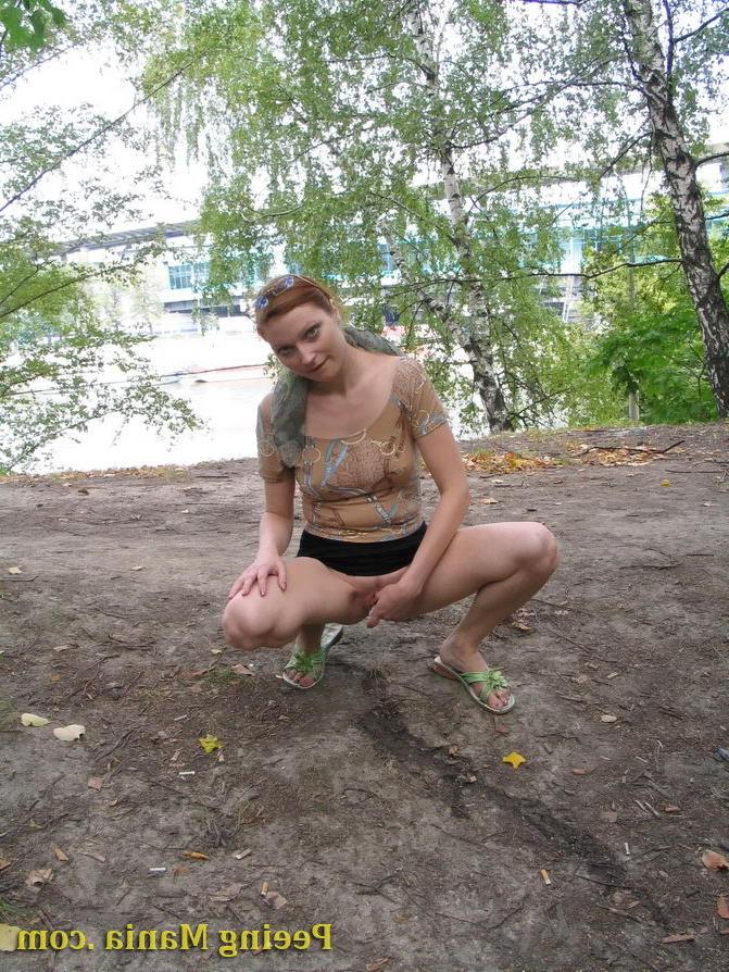 15P Longhaired beauty lifts up her skirt and squats to urinate riverside