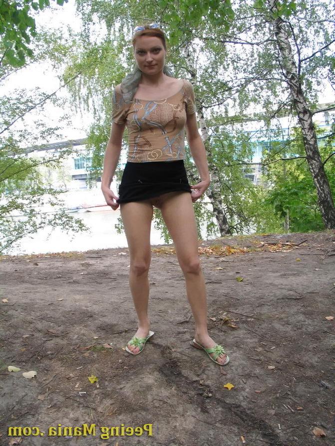 15P Longhaired beauty lifts up her skirt and squats to urinate riverside