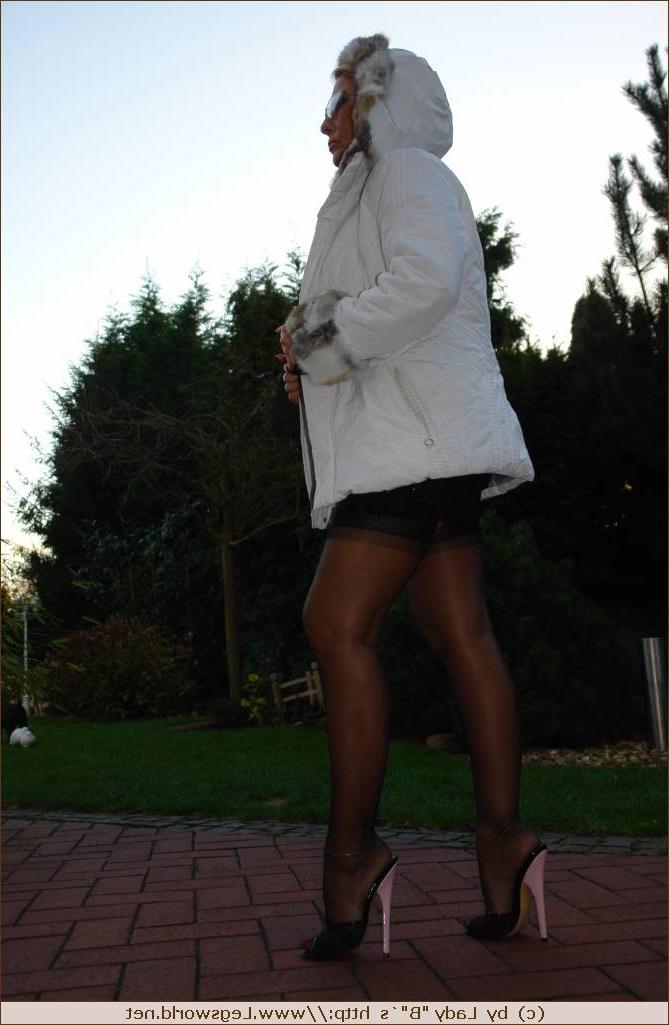 12P Lady Barbara in black stockings and heels outoors