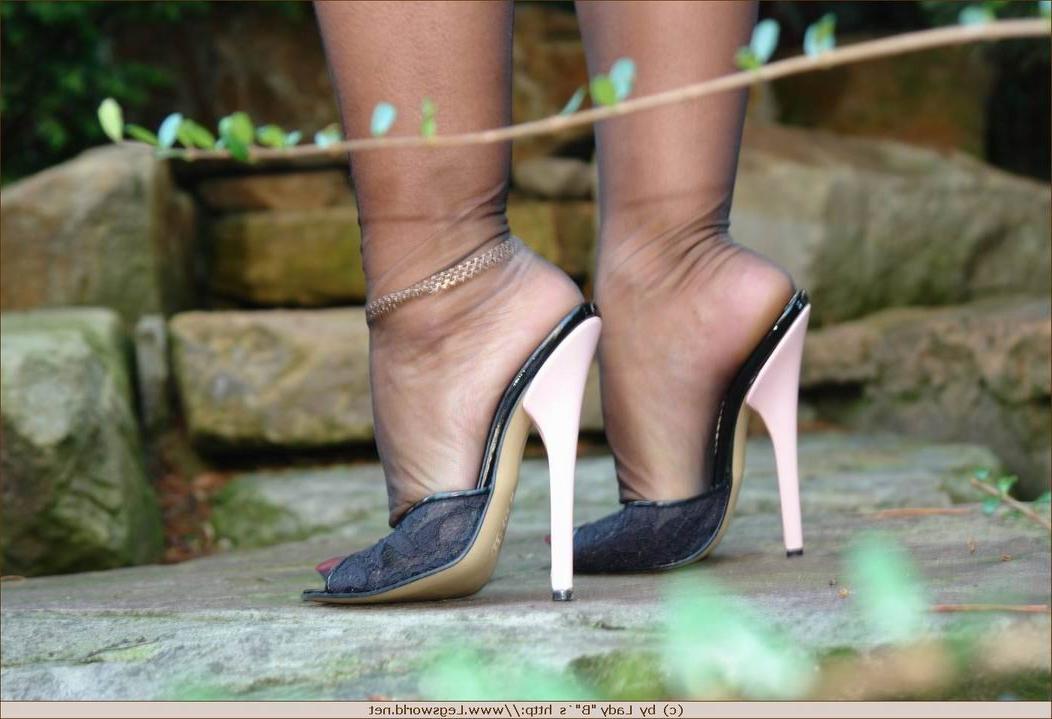 12P Lady Barbara in black stockings and heels outoors