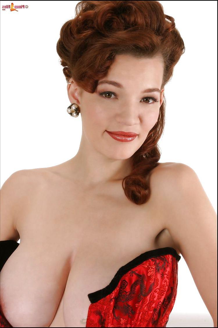 12P Awesome busty redhead in red corset