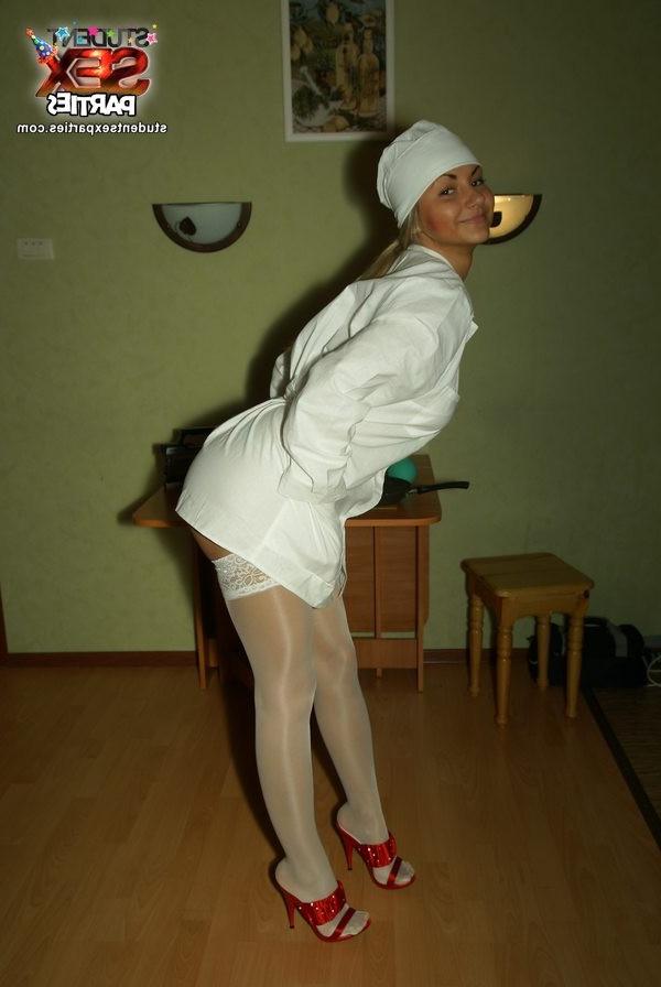 8P Young chick in horny nurse outfit strips