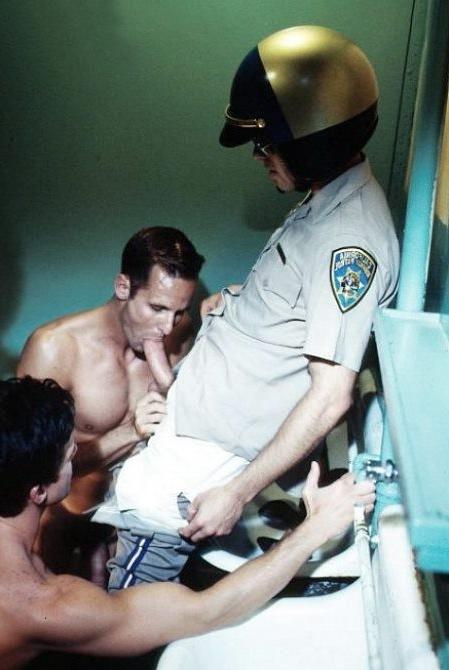 20P Curious cop getting sucked by two muscle dudes in a toilet