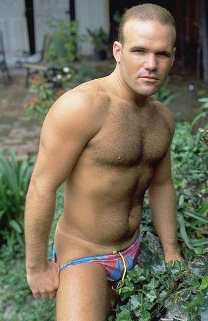 20P A hairy chested outdoor knight showing in and out of speedos
