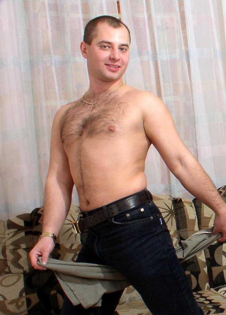 20P Horny gay bear loves to striptease and pose naked on couch