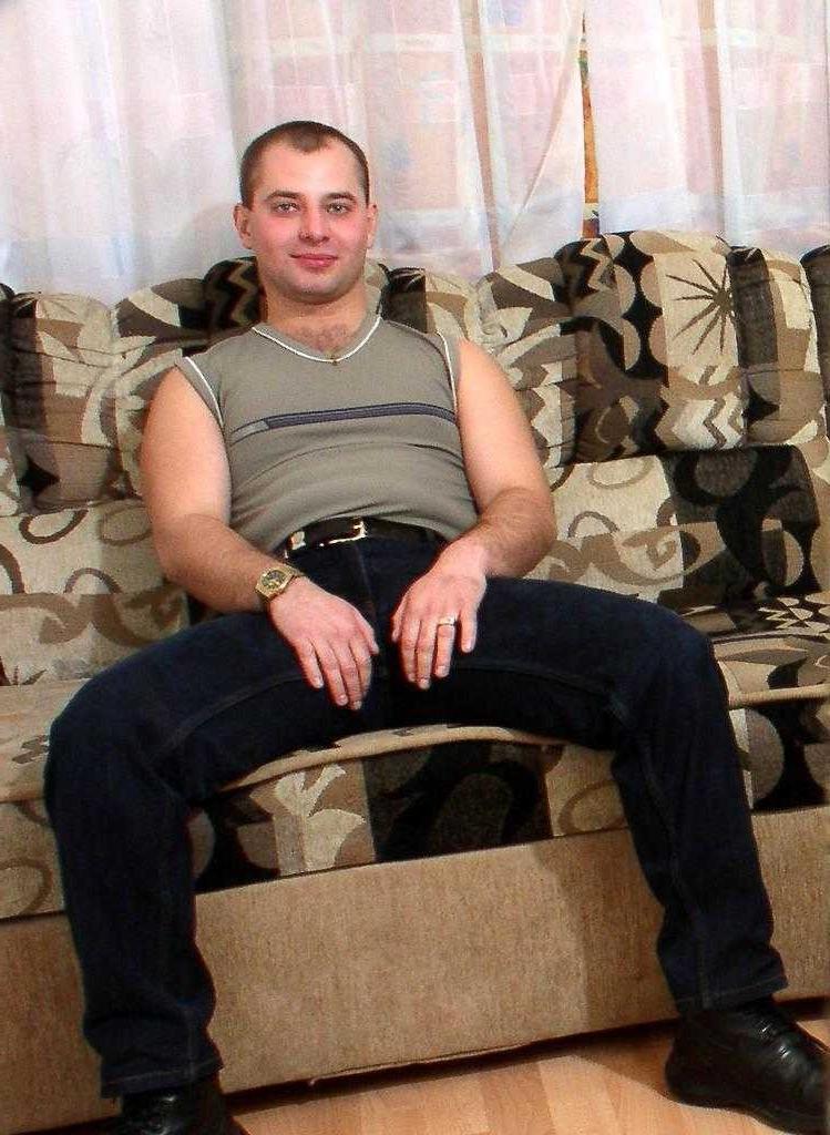 20P Horny gay bear loves to striptease and pose naked on couch