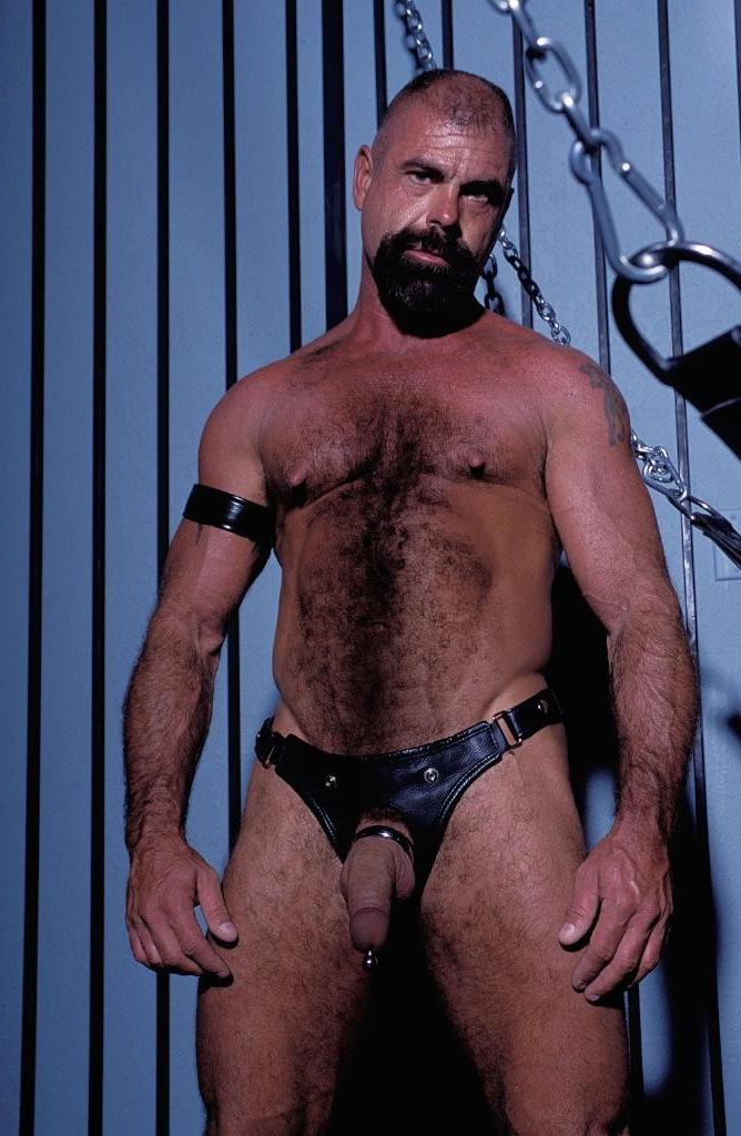 20P Gay bear loves playing his pierced huge cock in leather