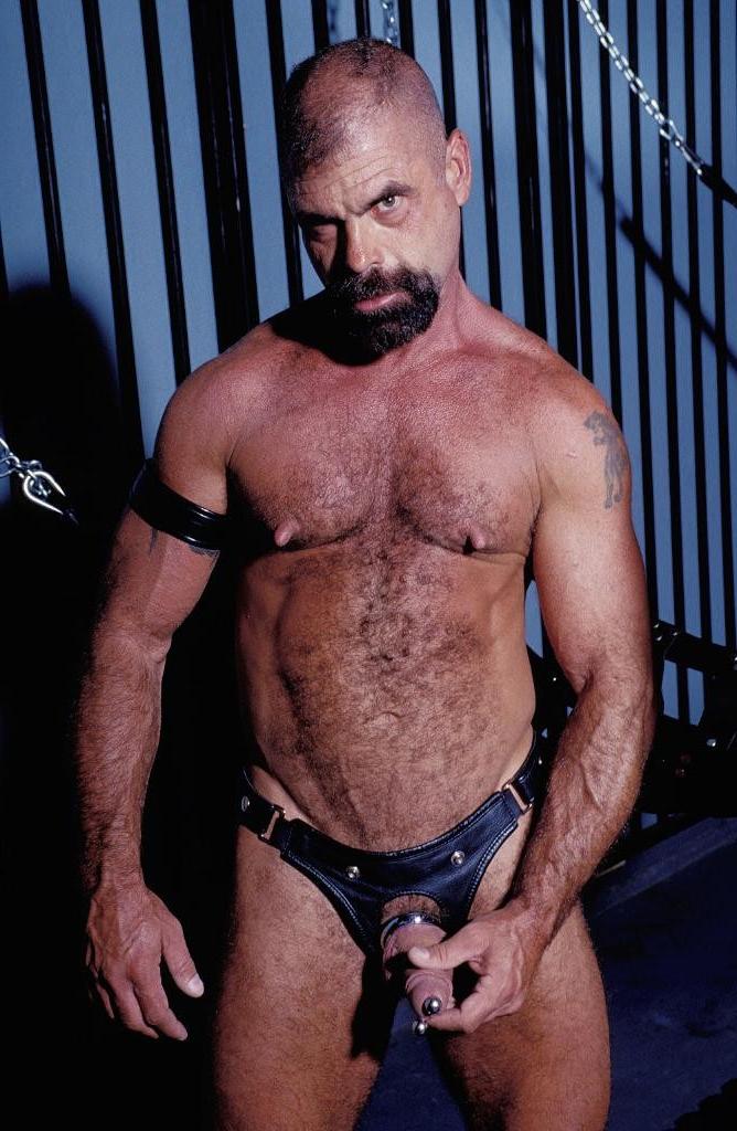 20P Gay bear loves playing his pierced huge cock in leather