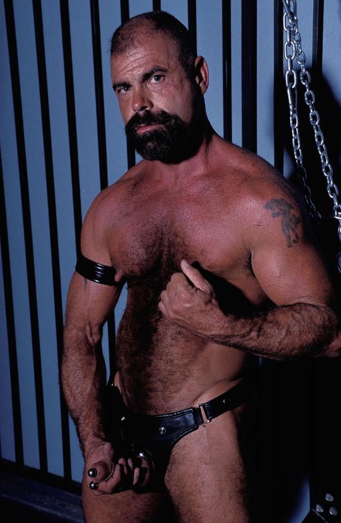 20P Gay bear loves playing his pierced huge cock in leather