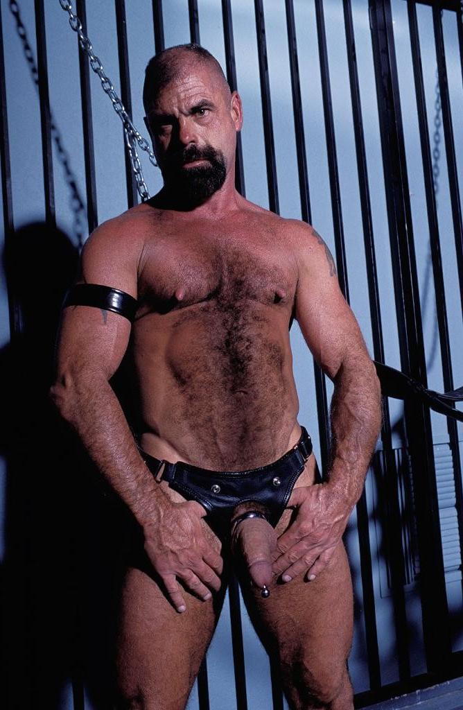 20P Gay bear loves playing his pierced huge cock in leather