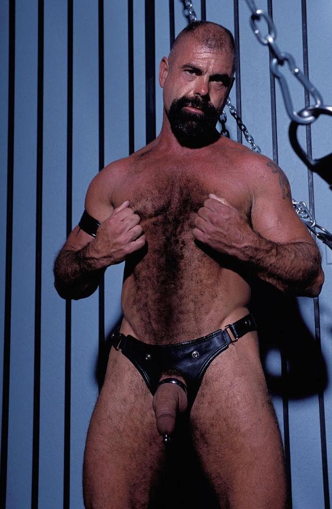 20P Gay bear loves playing his pierced huge cock in leather