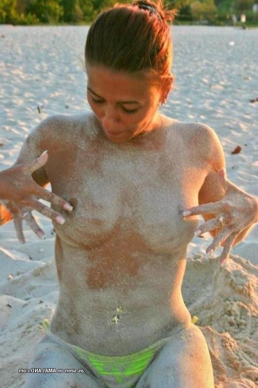 10P Compilation of a sexy Latina babe posing topless at a beach