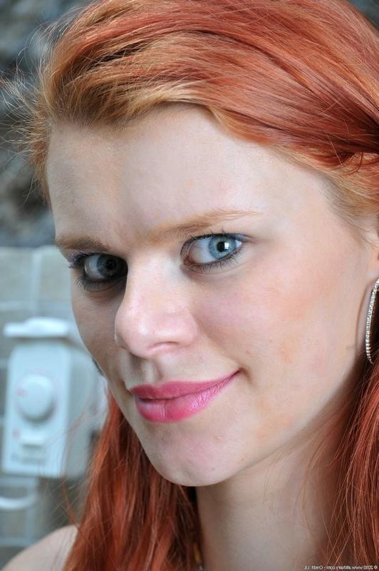 15P Sultry redhead Benji reveals her hairy pussy