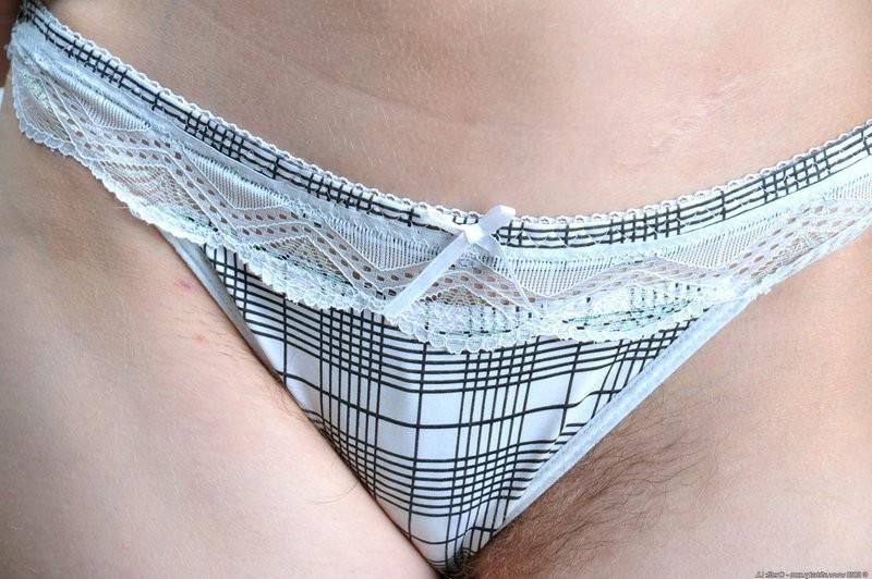 15P Sultry redhead Benji reveals her hairy pussy
