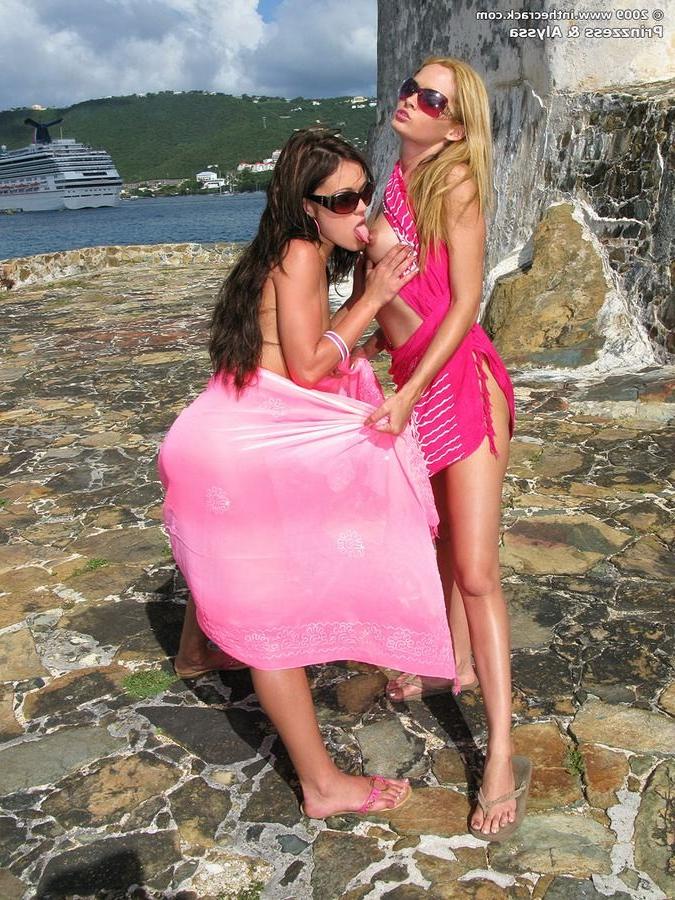 15P Beautiful lesbians strip and lick pussies outdoors
