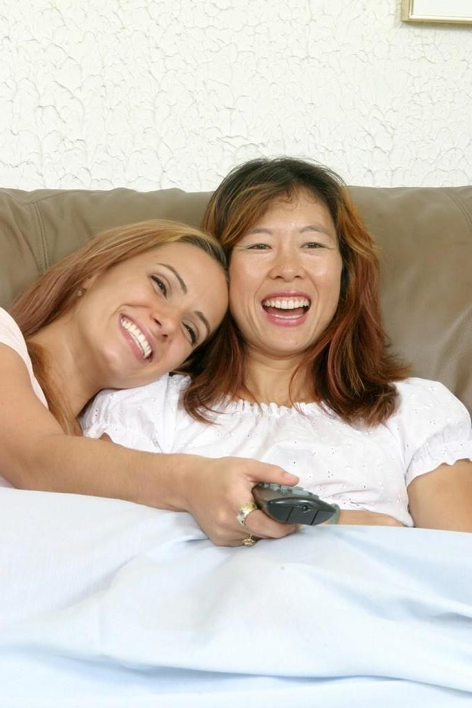 20P Horny lesbo babes loving a tit fondling on a couch