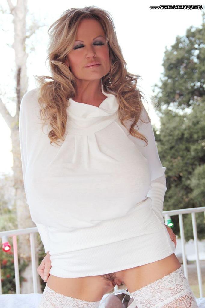 16P Busty Kelly Madison posing in her white lingerie