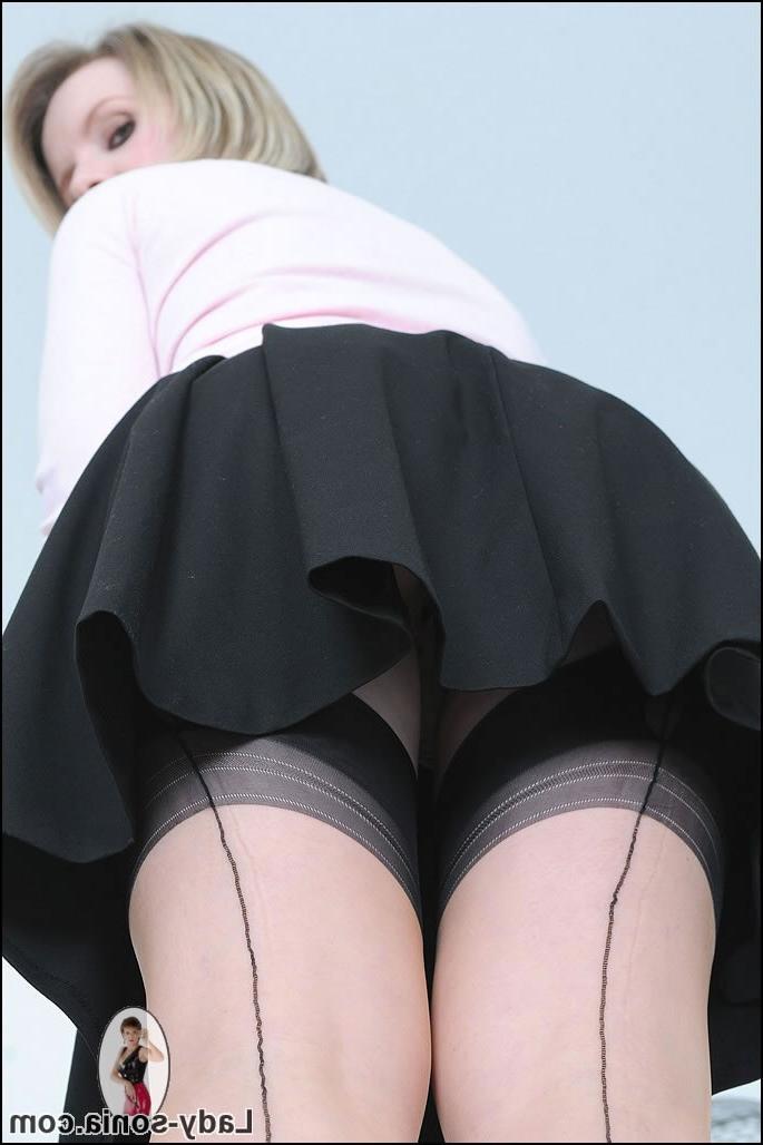 15P Busty milf flashes some upskirt ass while on ladder