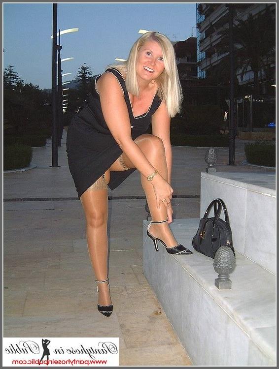 15P amateur woman showing her stockings outside