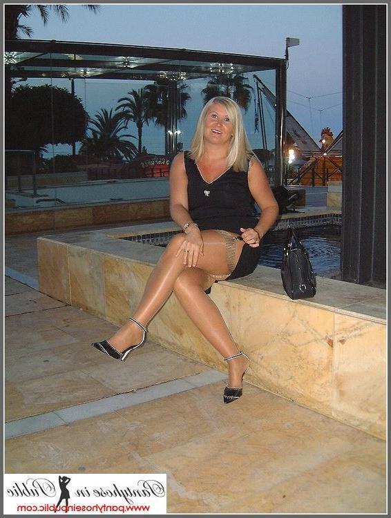 15P amateur woman showing her stockings outside