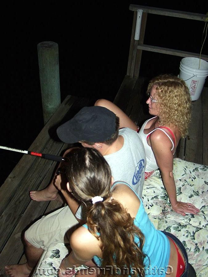 16P Two girlfriends service guy on outdoor jetty