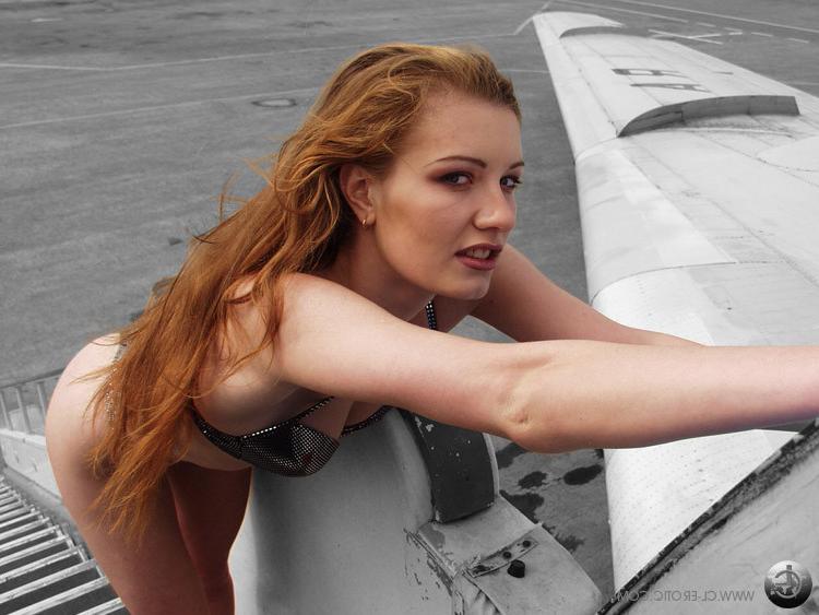 17P Flexible redhead stewardess doing the splits