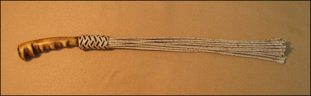 6P Evenki Cat. 12-tail leather braided flogger.