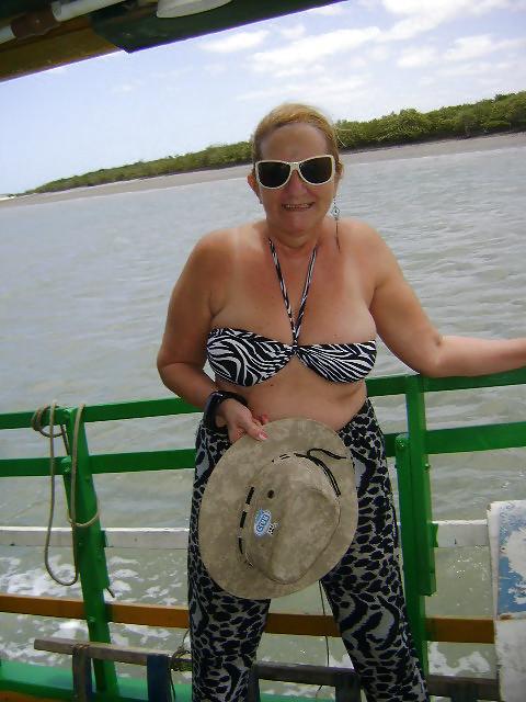 24P Women with saggy tits in swimsuit.