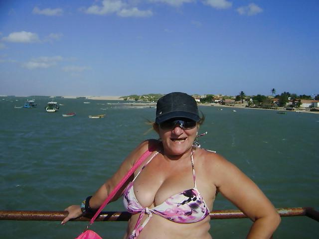24P Women with saggy tits in swimsuit.