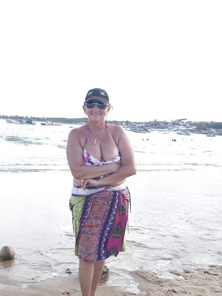 24P Women with saggy tits in swimsuit.
