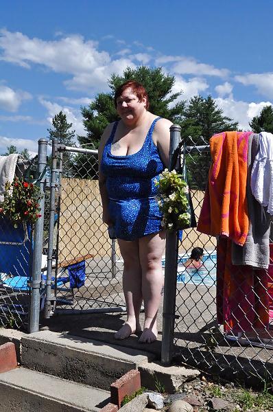 24P Women with saggy tits in swimsuit.