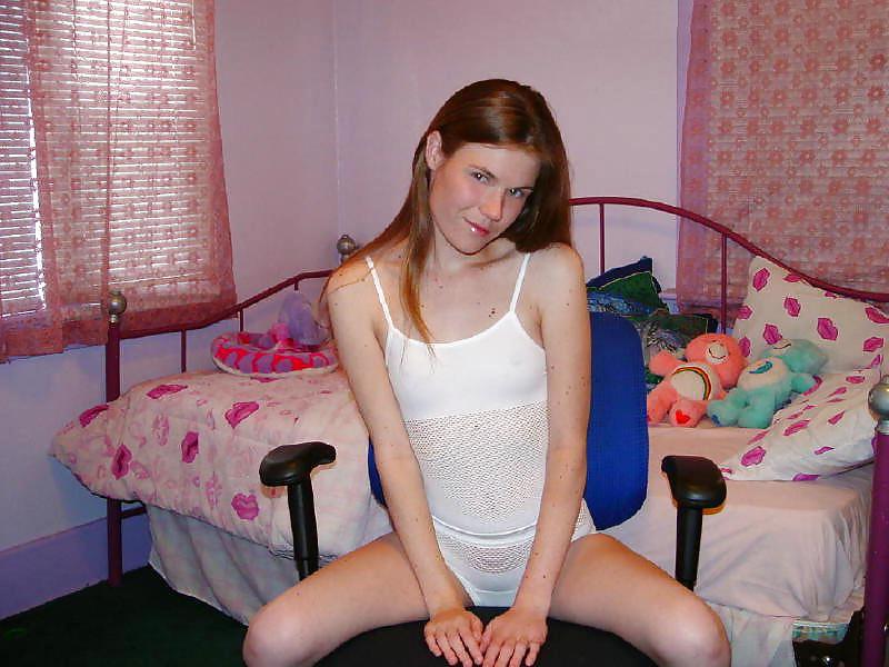 19P Slim pornstar Melissa undressing in her bedroom