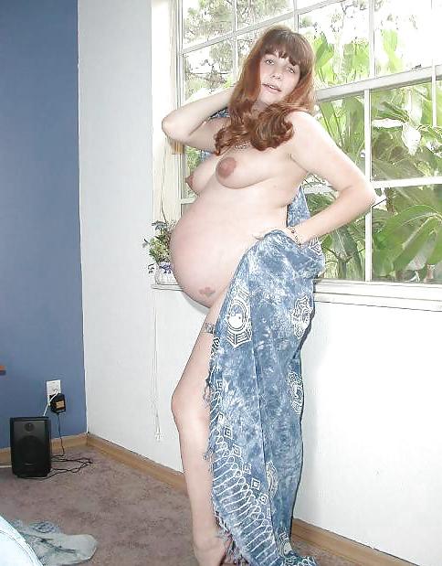 25P Pregnant brunette posing her plump body