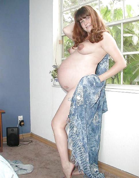 25P Pregnant brunette posing her plump body