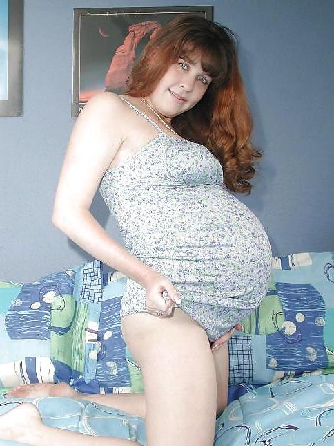 25P Pregnant brunette posing her plump body