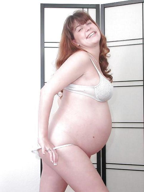 25P Pregnant brunette posing her plump body