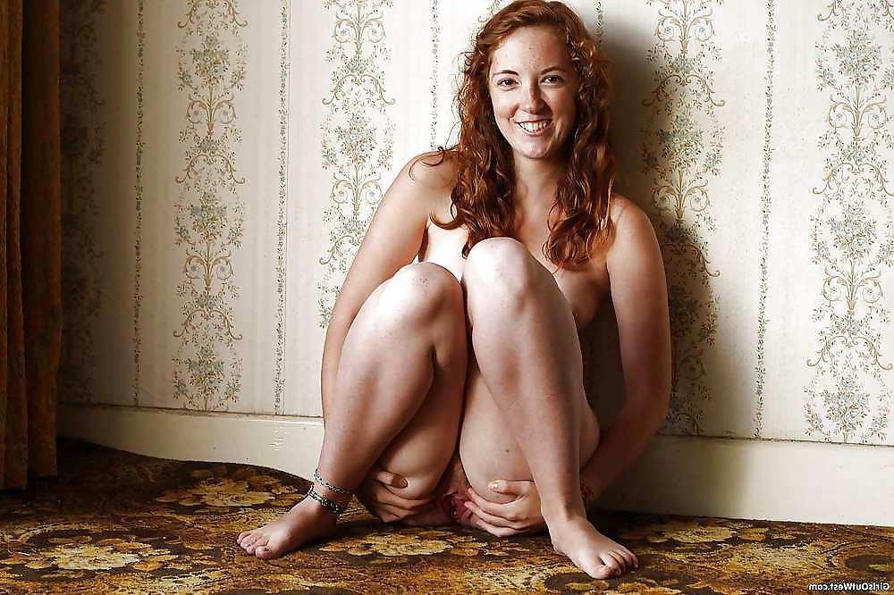 16P Redhead strips green dress to show pussy