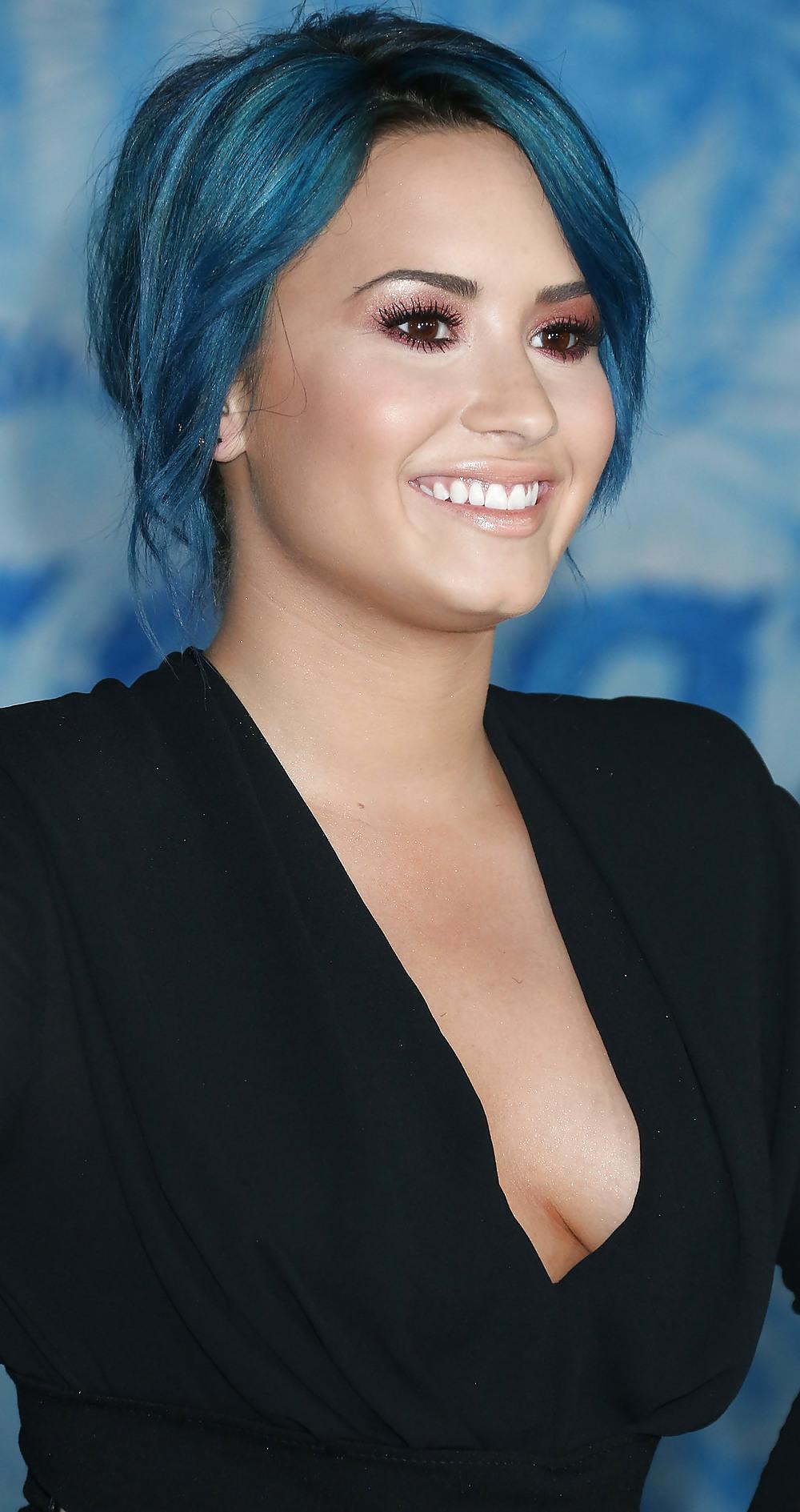 25P Demi Lovato with blue hair and business style