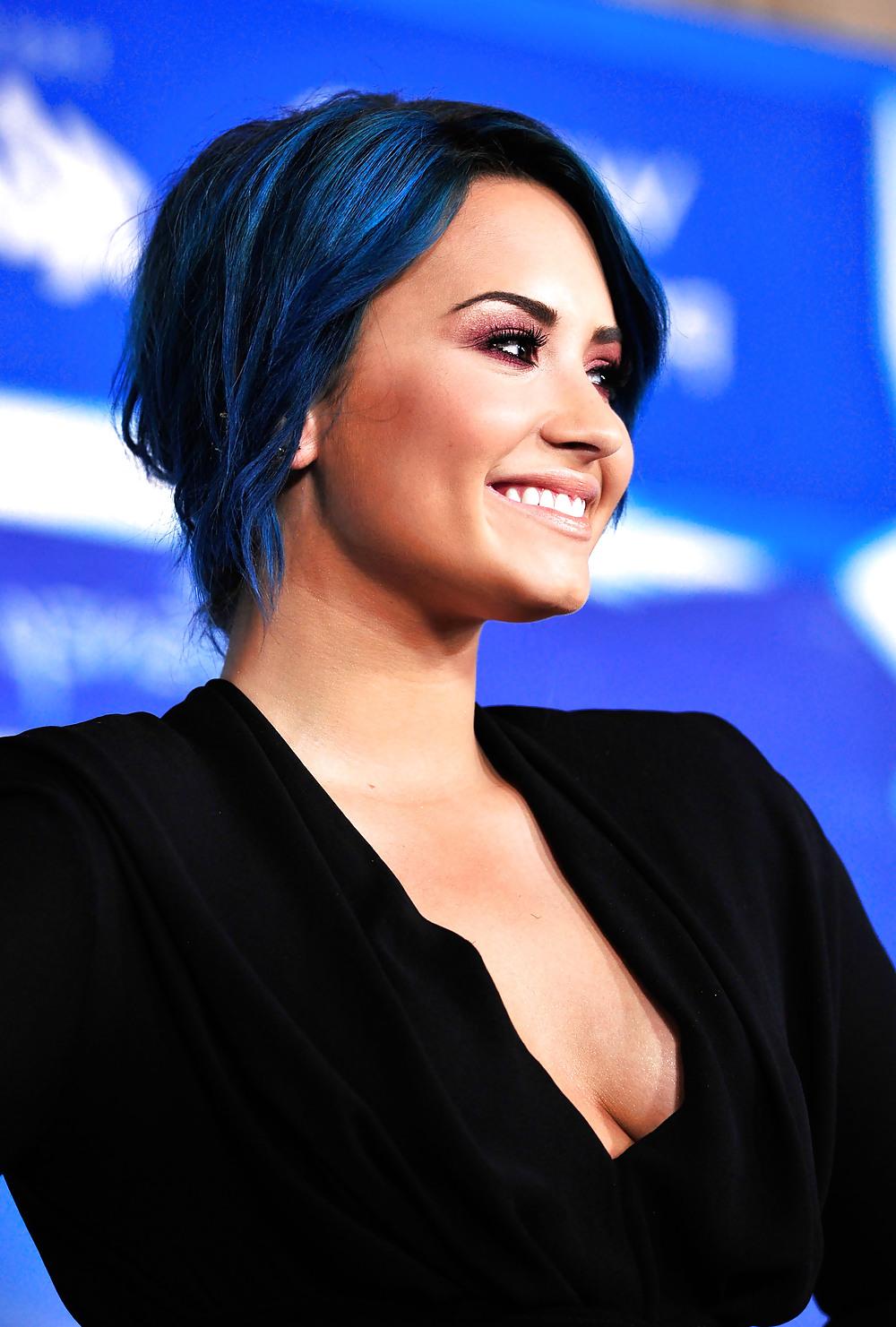 25P Demi Lovato with blue hair and business style
