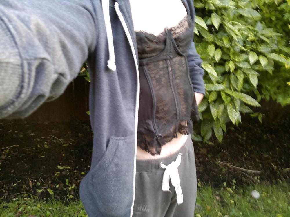 4P In the woods with a black corset on.