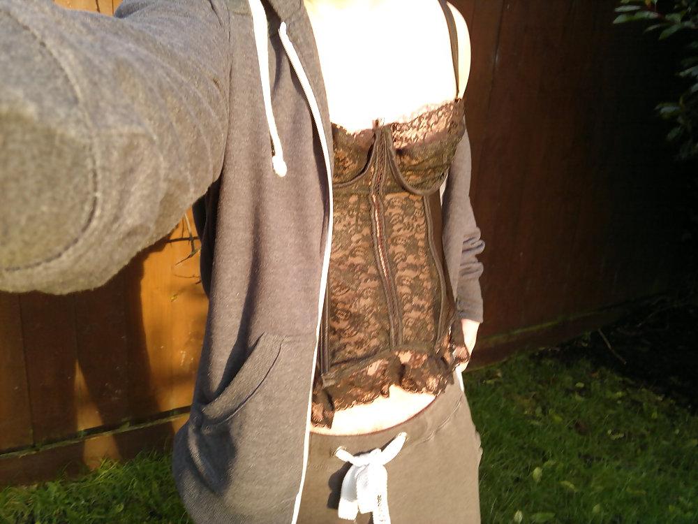 4P In the woods with a black corset on.
