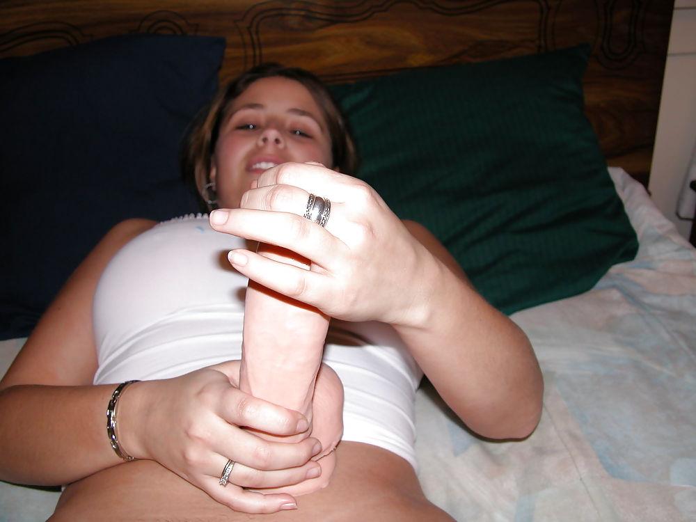 25P Young woman with big boobs shows her sex toys