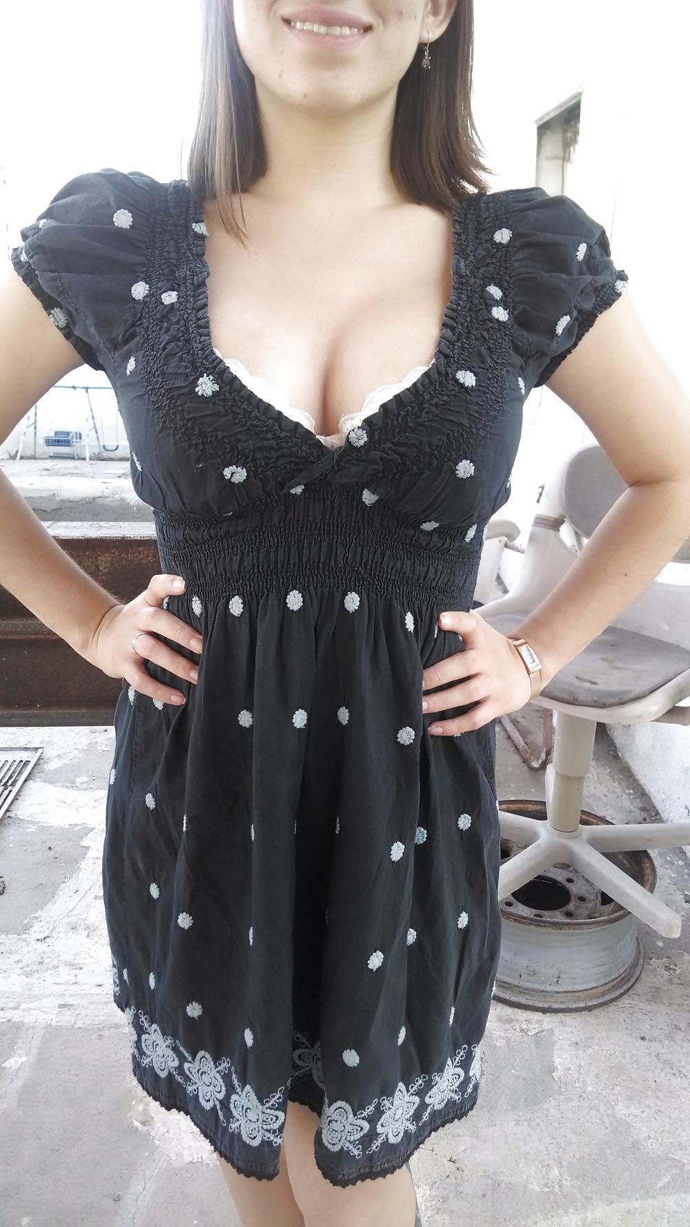 13P Busty Brunette Teasing in Black Dress