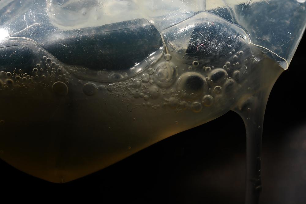 17P Precum and Cum dripping out of condoms (closeup)